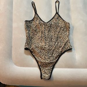 It’s a body suit with cheetah print . It’s a tank top style .